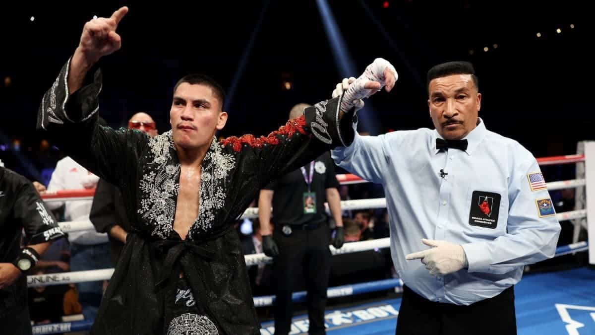 Vergil Ortiz and referee Tony Weeks