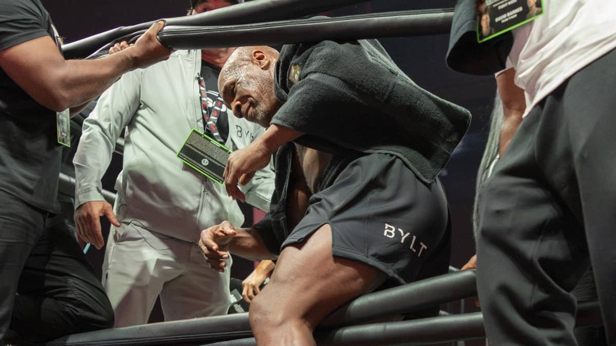Mike Tyson climbs in the ring 2024