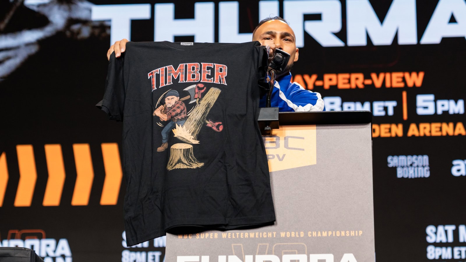 Keith Thurman holds a “TIMBER” T-shirt during a press conference ahead of his March 28 fight with Sebastian Fundora.