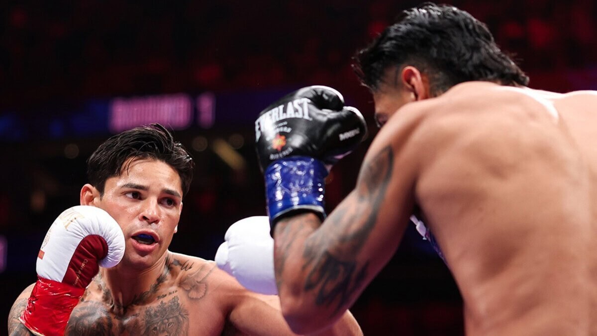 Ryan Garcia exchanges punches with Mario Barrios during their WBC welterweight title fight in Las Vegas