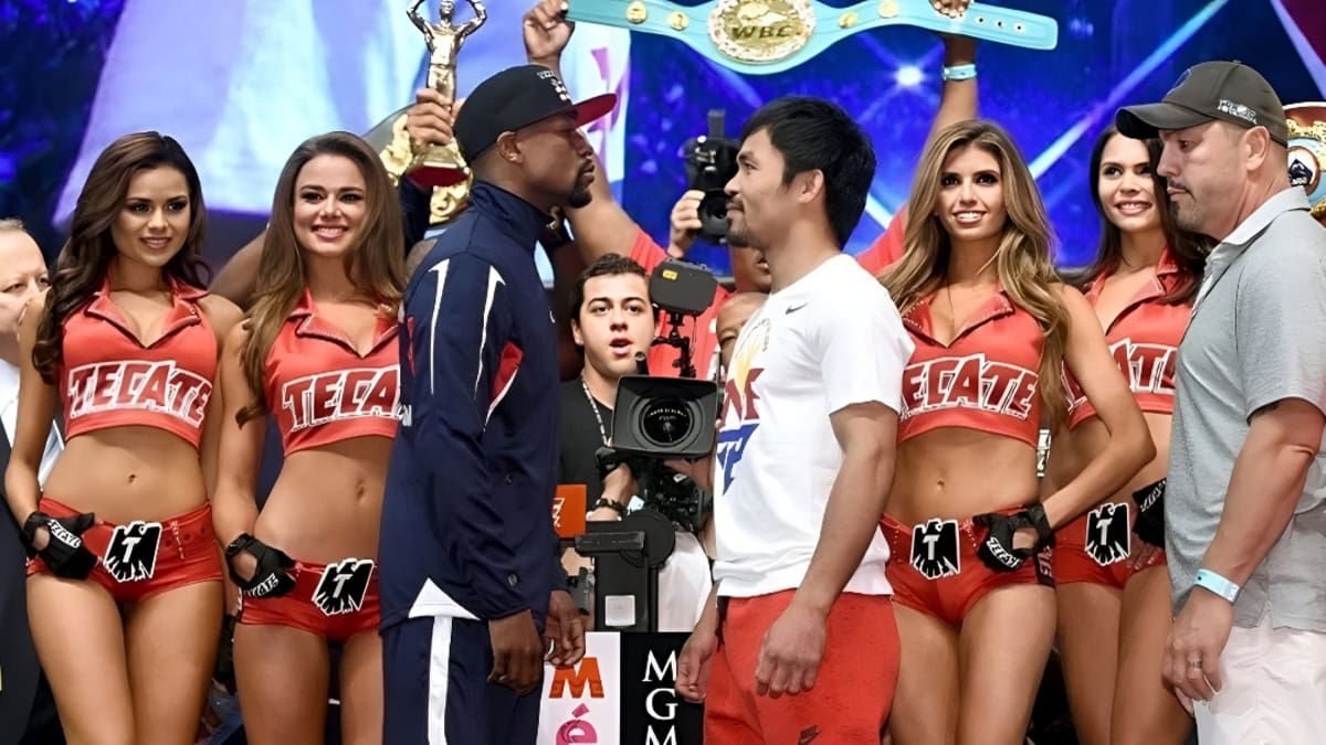 Floyd Mayweather and Manny Pacquiao face off at weigh-in with WBC championship belt displayed above