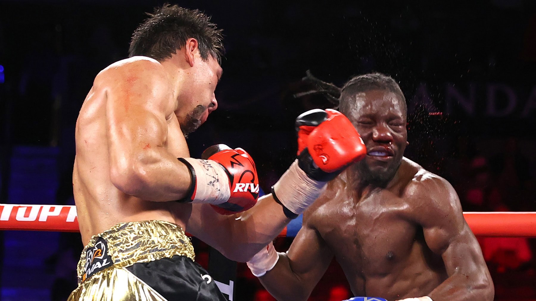 Zhanibek Alimkhanuly lands a punch during middleweight action.