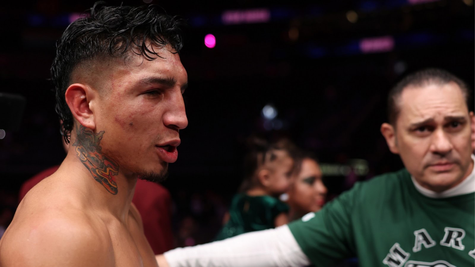 Mario Barrios with trainer Bob Santos following a fight as plans for a move to 154 pounds are discussed