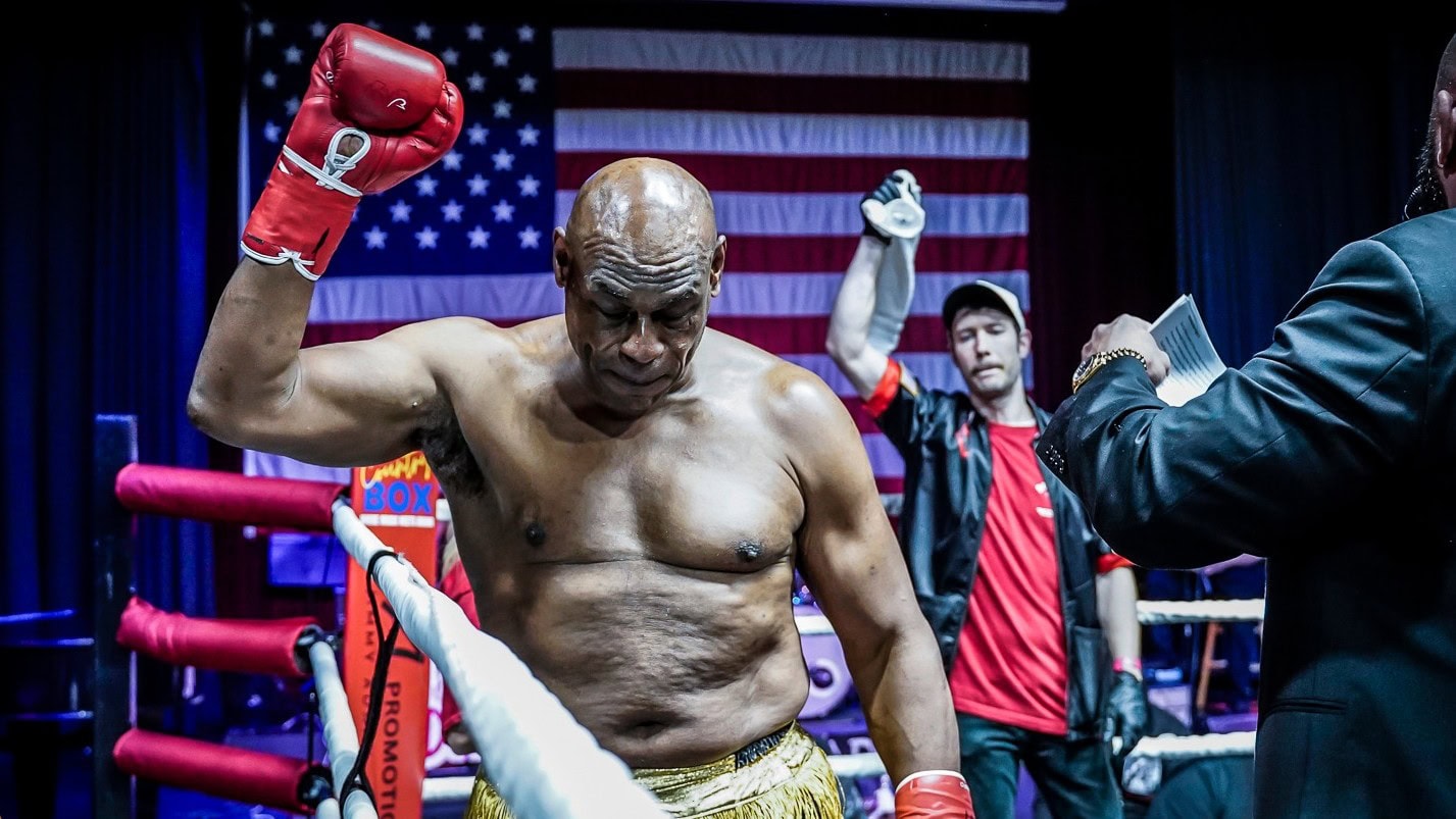 Oliver McCall raises his glove in the ring during a Country Box event in the United States.