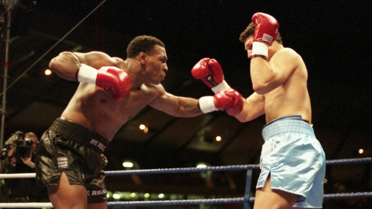 Mike Tyson throwing a punch in his professional career vs Lou Savarese