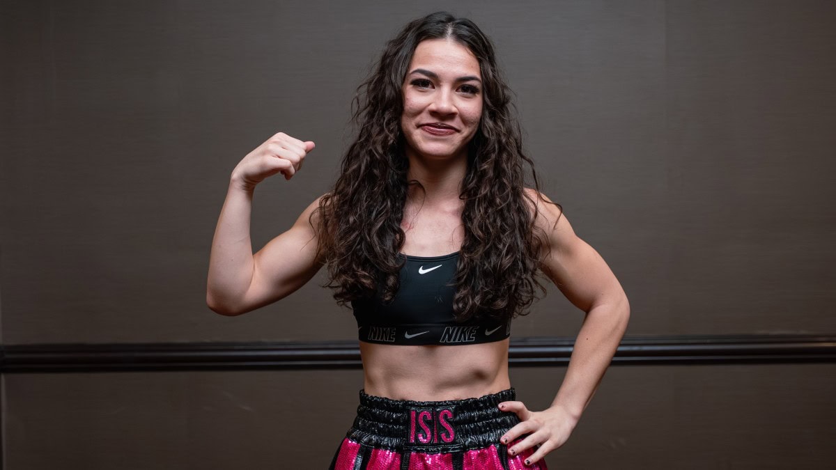 Isis Sio flexes during a weigh-in ahead of her professional boxing bout in California