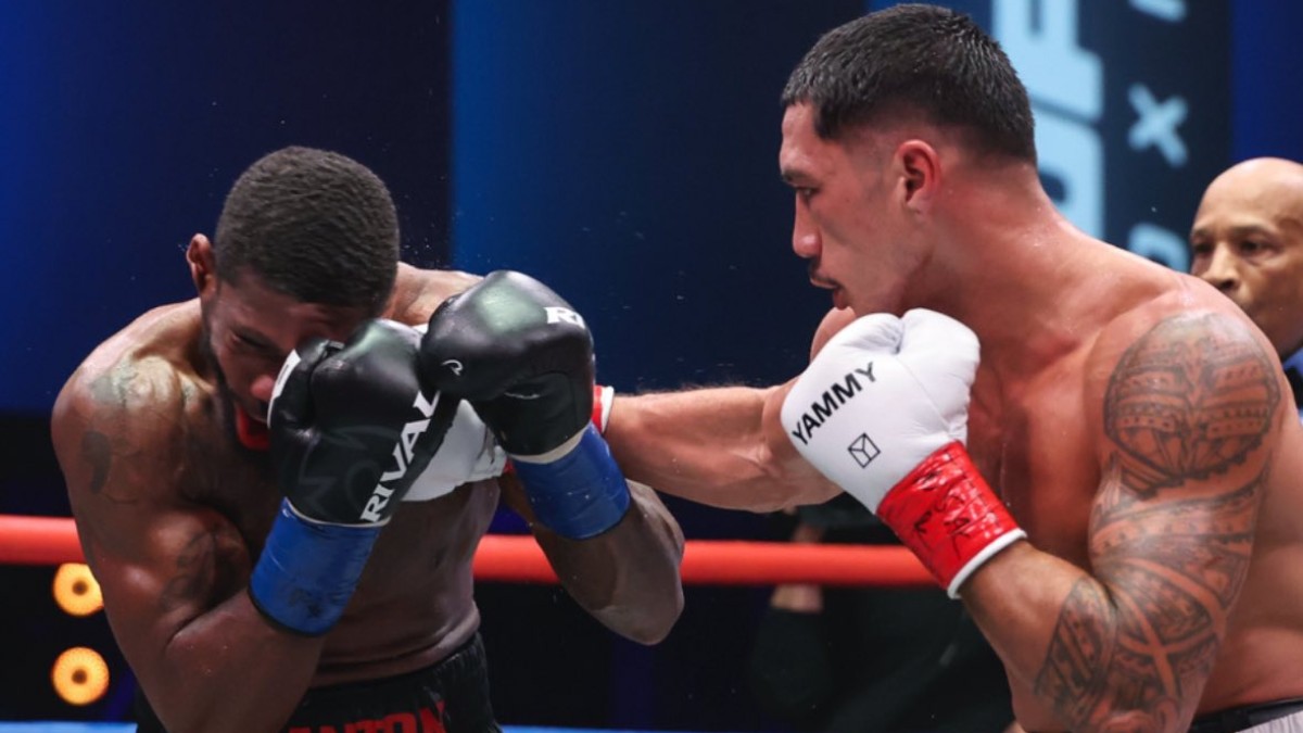 Jai Opetaia lands a right hand on Brandon Glanton during their cruiserweight title fight