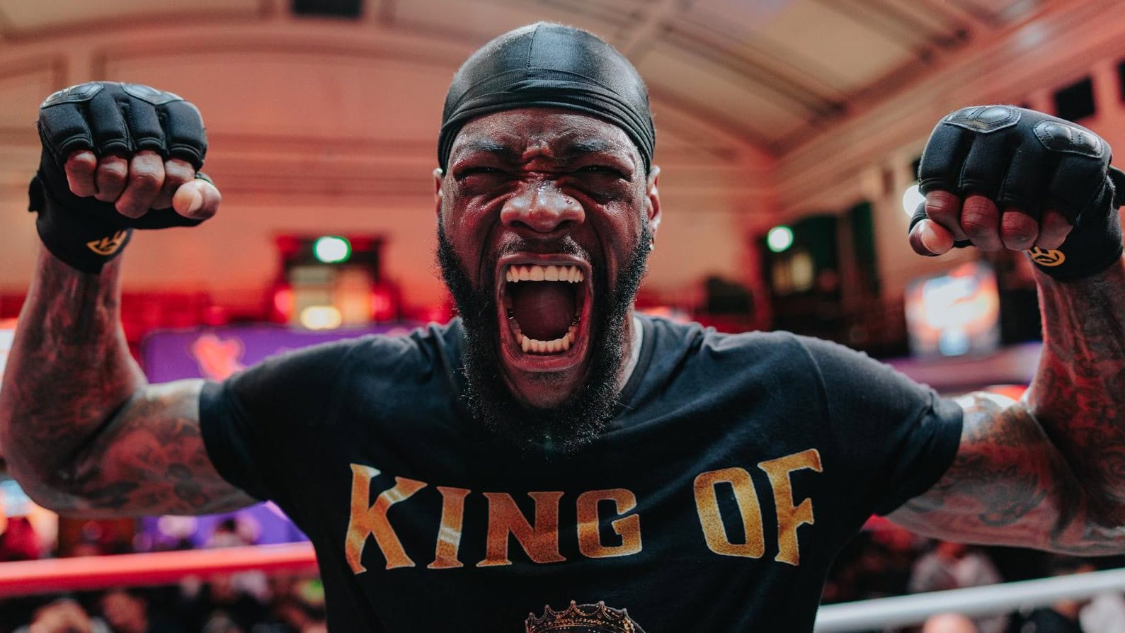 Deontay Wilder shouts with raised fists during a media appearance ahead of his proposed fight with Derek Chisora