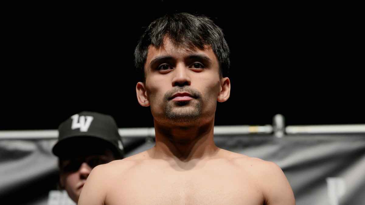 Jimuel Pacquiao poses on the scale during the weigh-in ahead of his second professional fight.