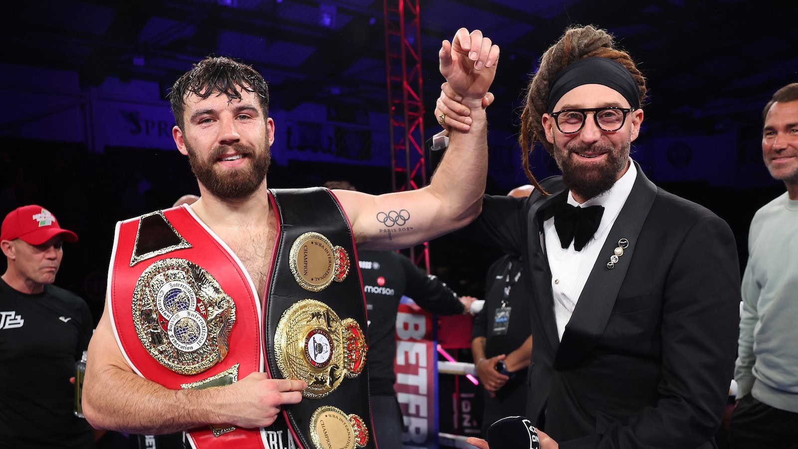 Pat Brown celebrates with the WBA International and IBF Intercontinental cruiserweight titles in Altrincham.