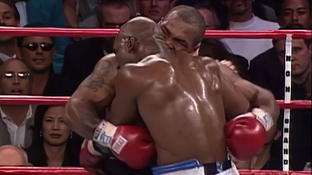Mike Tyson bites Evander Holyfield’s ear during their 1997 heavyweight rematch at the MGM Grand in Las Vegas
