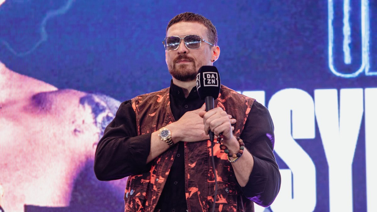 Oleksandr Usyk heavyweight champion speaking during boxing event