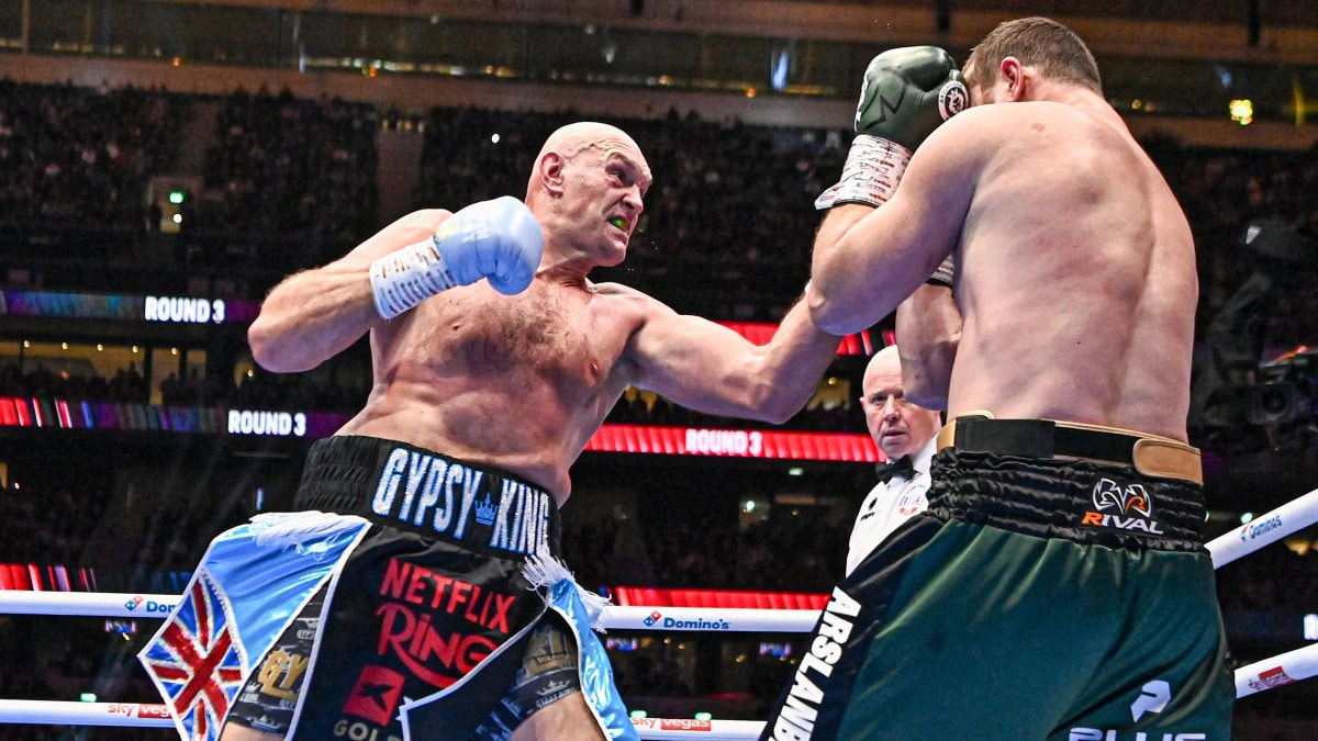 Tyson Fury lands a punch on Arslanbek Makhmudov during their heavyweight fight at Tottenham Hotspur Stadium