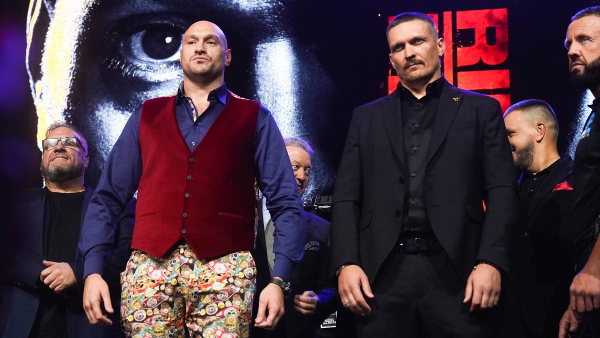 Tyson Fury and Oleksandr Usyk stand on stage before their heavyweight rematch