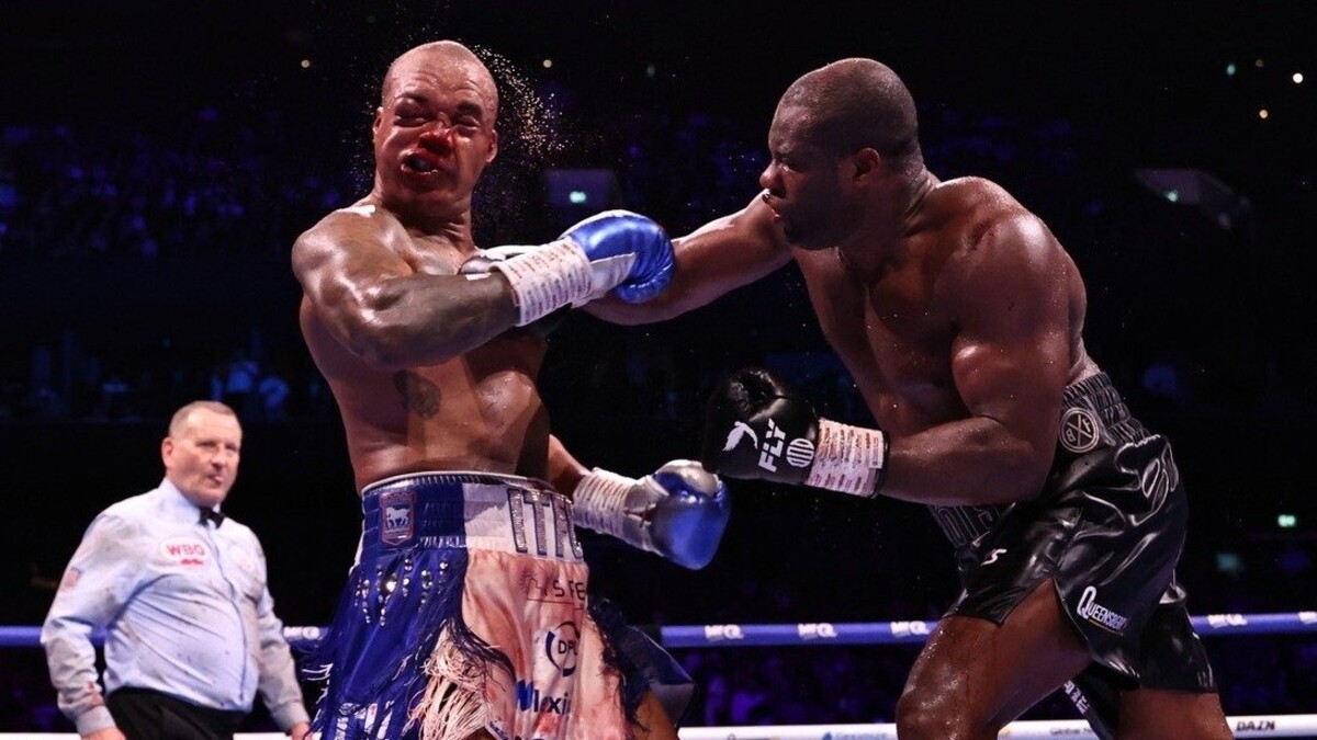 Fabio Wardley takes a heavy right hand from Daniel Dubois during their WBO heavyweight title fight in Manchester as Dubois stages a comeback victory.
