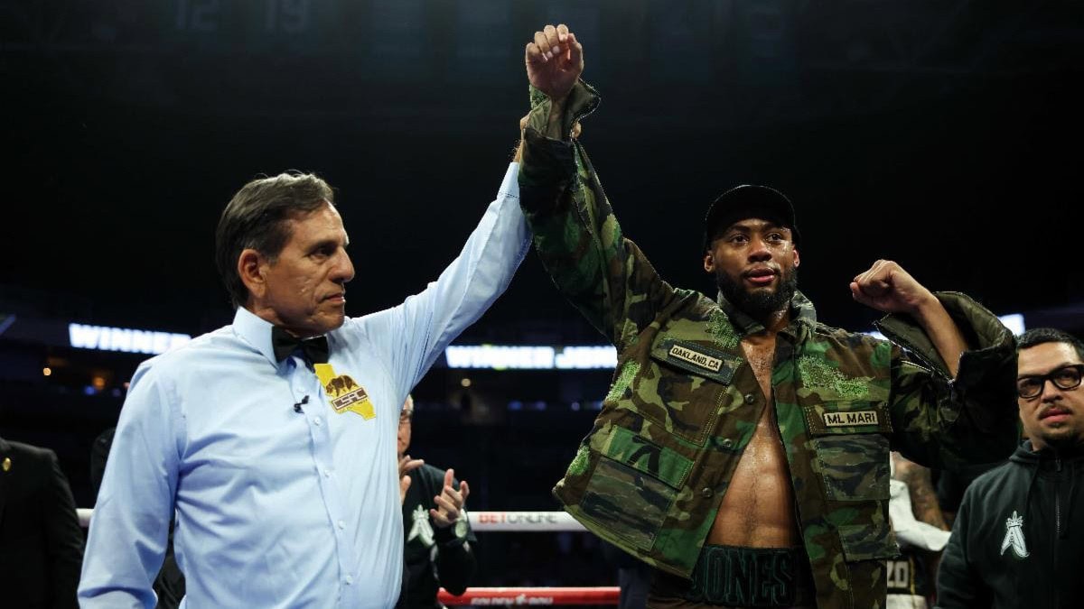 Amari Jones celebrates with his arm raised after stopping former world champion Vincenzo Gualtieri during their middleweight fight in San Jose.