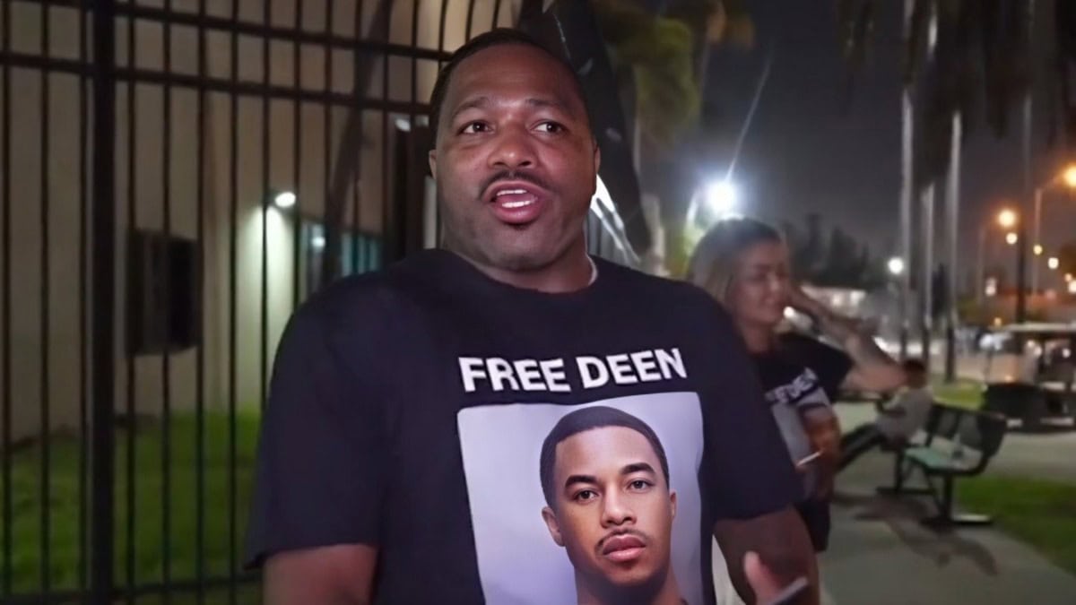 Adrien Broner wearing a “Free Deen” shirt outside a Miami-Dade jail during a livestream after DeenTheGreat’s arrest.