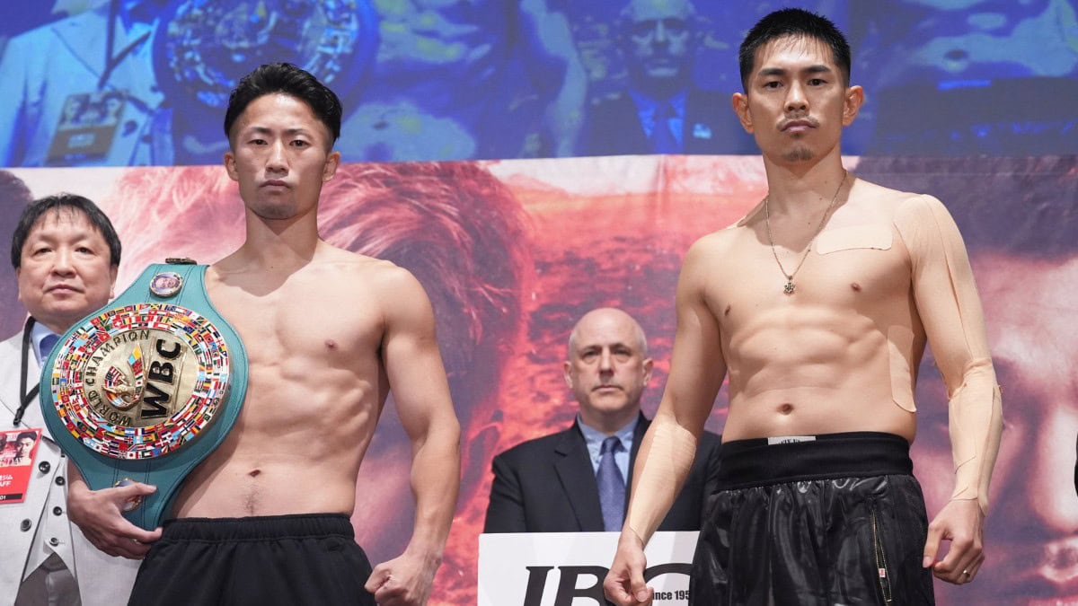 Takuma Inoue and Kazuto Ioka pose during the official weigh-in ahead of their bantamweight world title fight at Tokyo Dome.