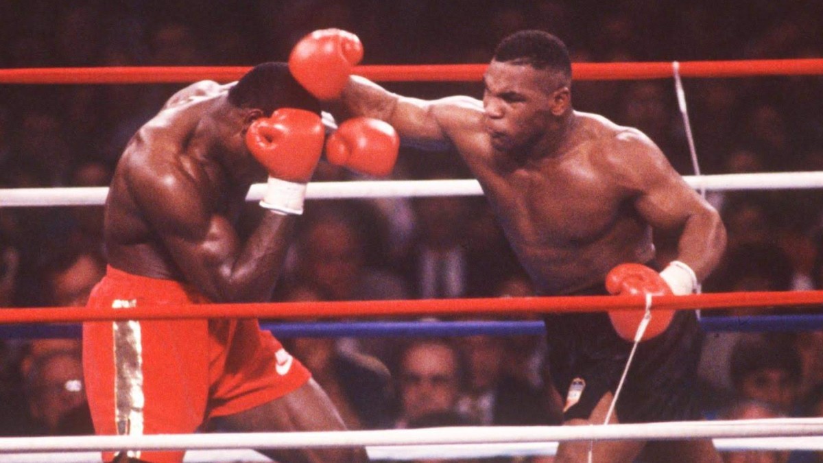 Mike Tyson lands a right hand on Frank Bruno during their heavyweight world title rematch in Las Vegas
