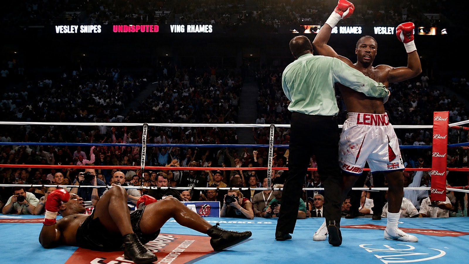 Lennox Lewis celebrates after knocking down Mike Tyson during their heavyweight championship fight in Memphis in 2002, moments before Lewis secured an eighth-round stoppage victory