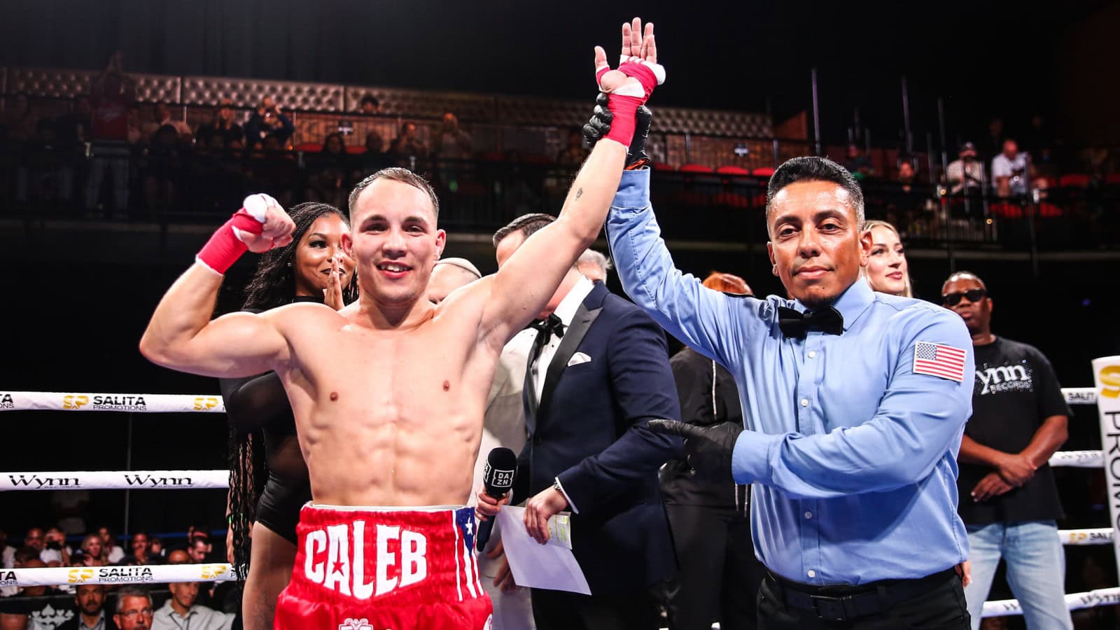 Caleb Tirado celebrates victory in the ring after a unanimous decision win in Grand Rapids