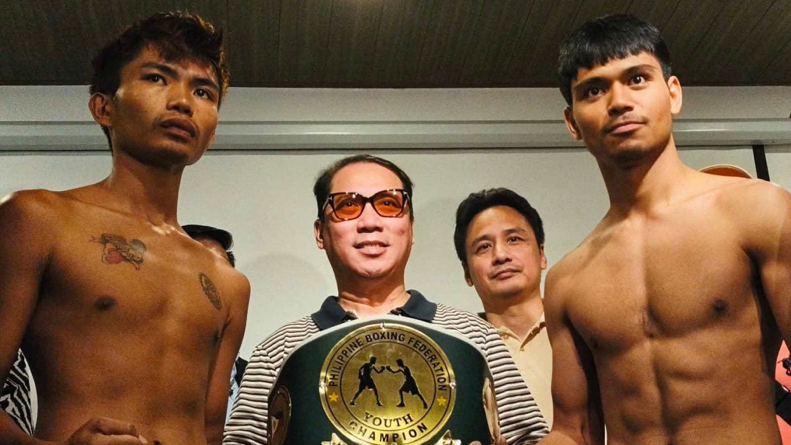 Eman Bacosa and Rodelyn Perez pose alongside officials and the Philippine Boxing Federation youth lightweight title belt before their rematch