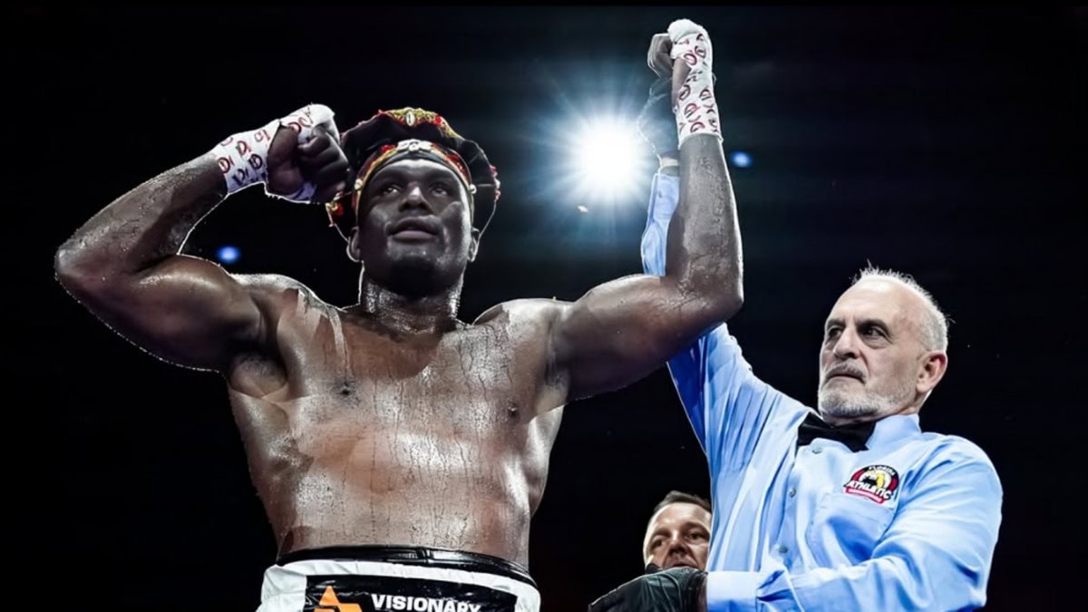 Gustavo Trujillo celebrates another heavyweight knockout victory after his hand is raised in the ring