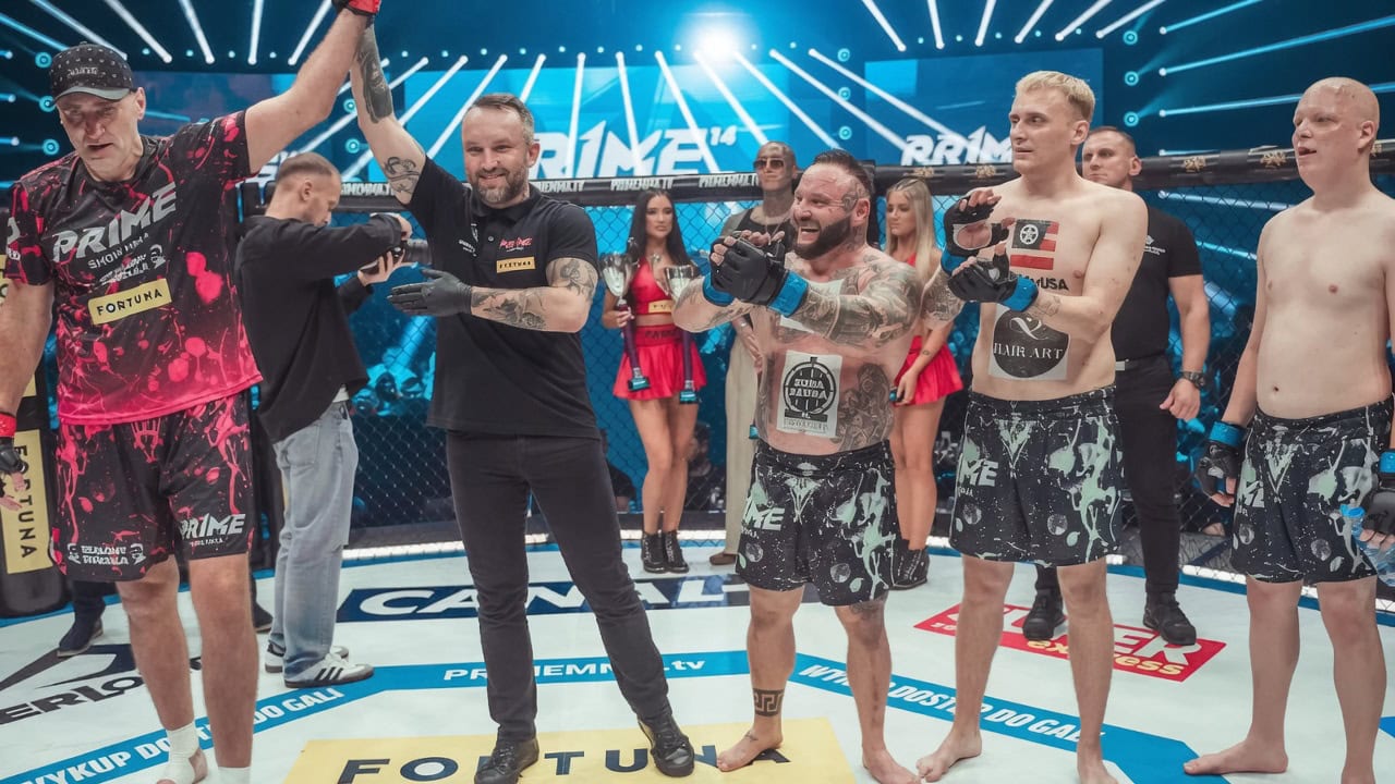 Mariusz Wach celebrates after defeating three opponents simultaneously in a 3-on-1 MMA bout in Poland