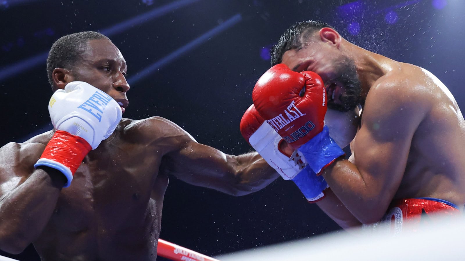 Bruce Carrington lands a left hand on Rene Palacios during his WBC featherweight title defense in Brooklyn