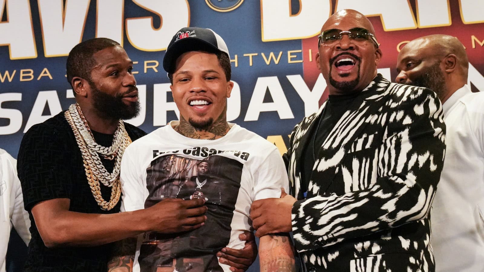 Floyd Mayweather and Leonard Ellerbe stand on the stage at a Gervonta Davis press conference