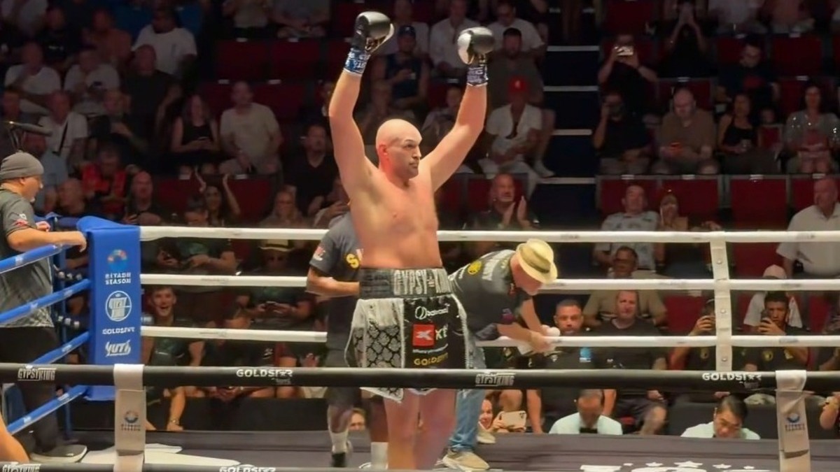 Tyson Fury celebrates after defeating Mariusz Wach by seventh-round stoppage in Thailand