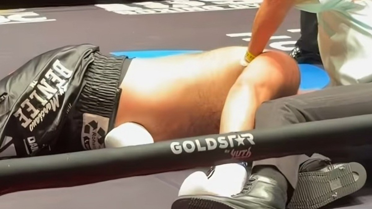 Daniel Baer lies on the canvas after being knocked out by Simon Ibekwe on Tyson Fury