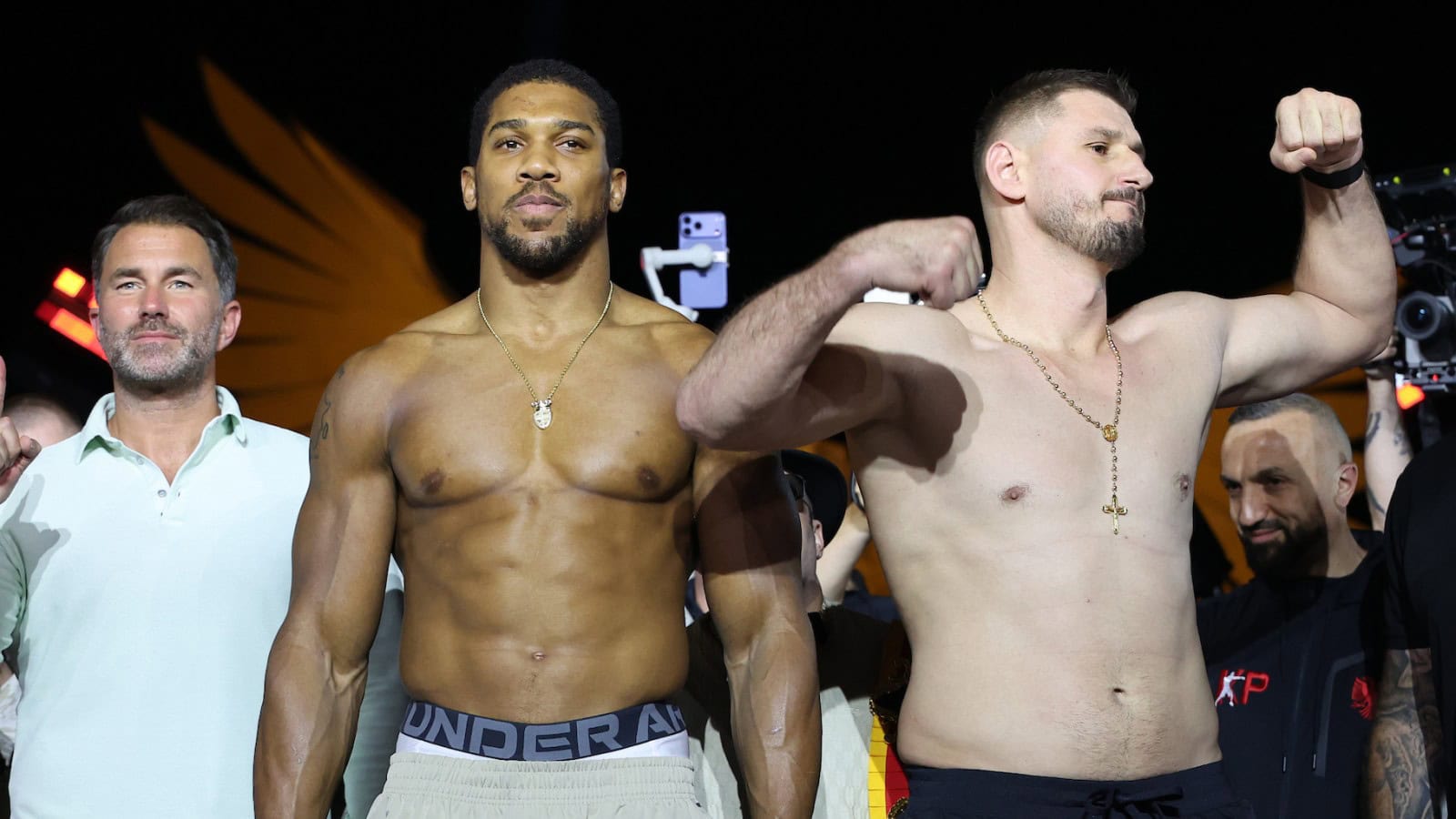 Anthony Joshua and Kristian Prenga pose during the official weigh-in before their heavyweight fight at the Jeddah Superdome in Saudi Arabia