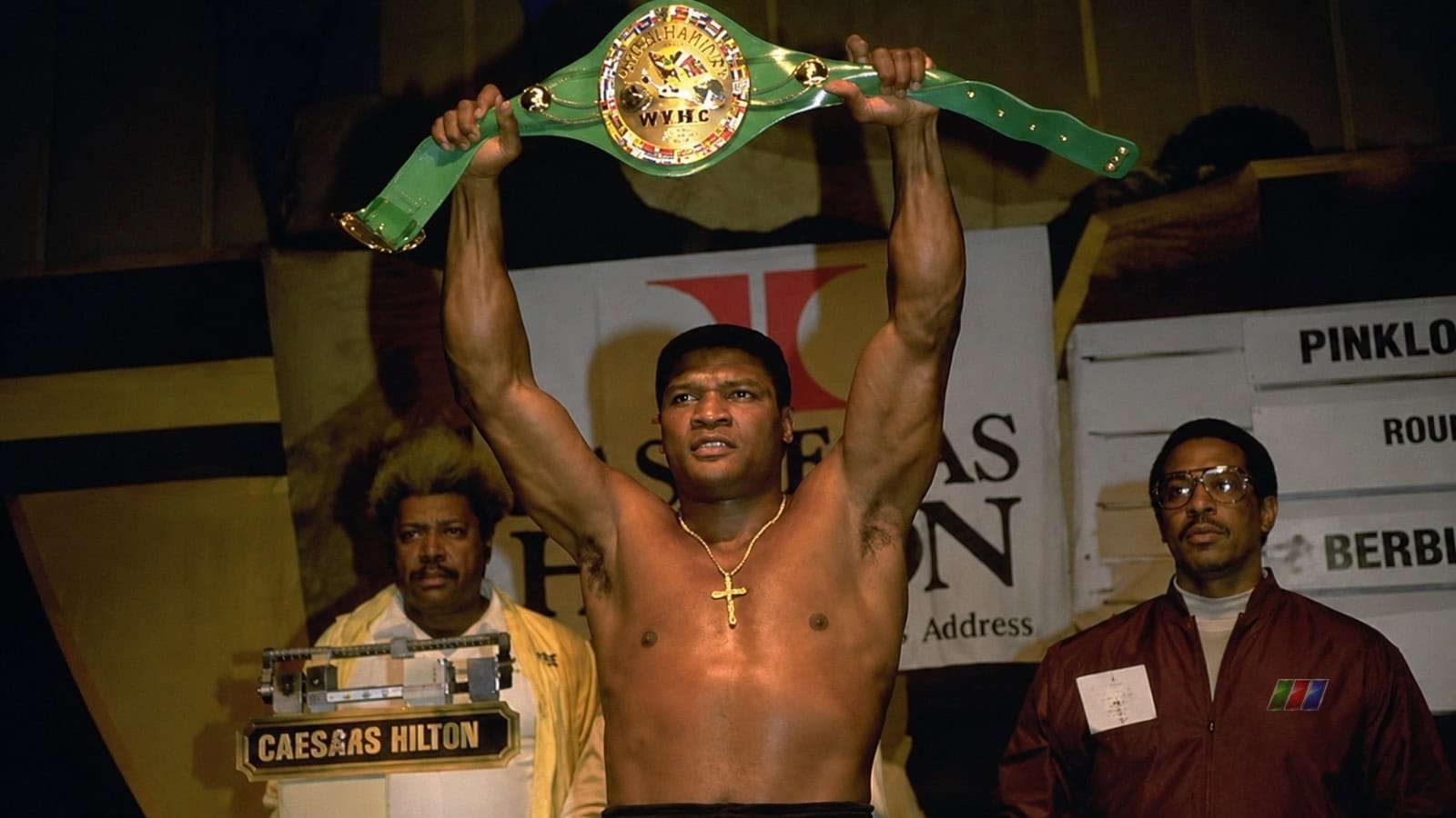Trevor Berbick holds the WBC heavyweight title during the weigh-in before his world title defense against Mike Tyson in 1986