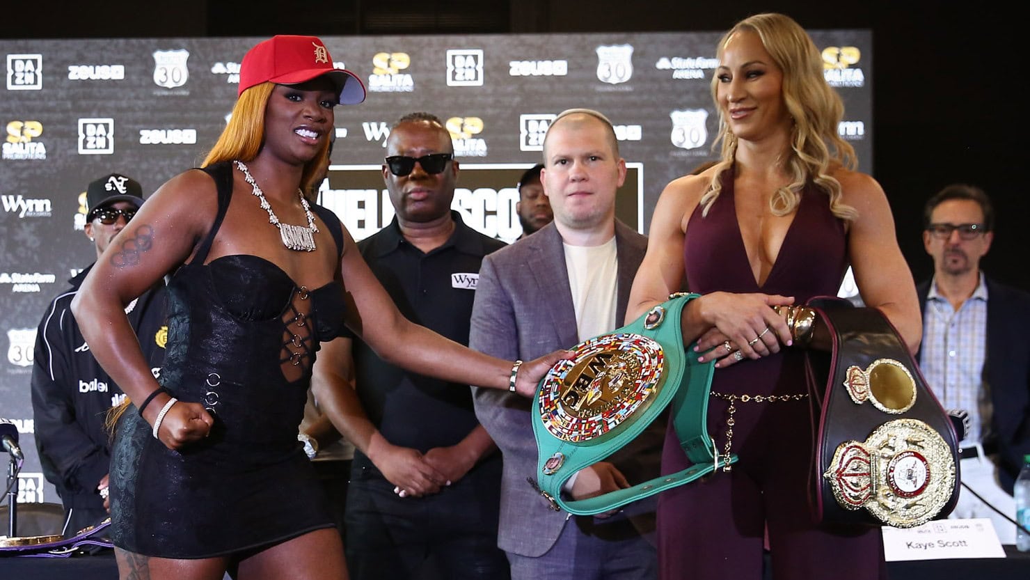 Claressa Shields and Kaye Scott pose with their world title belts ahead of their August 15 middleweight championship fight in Atlanta