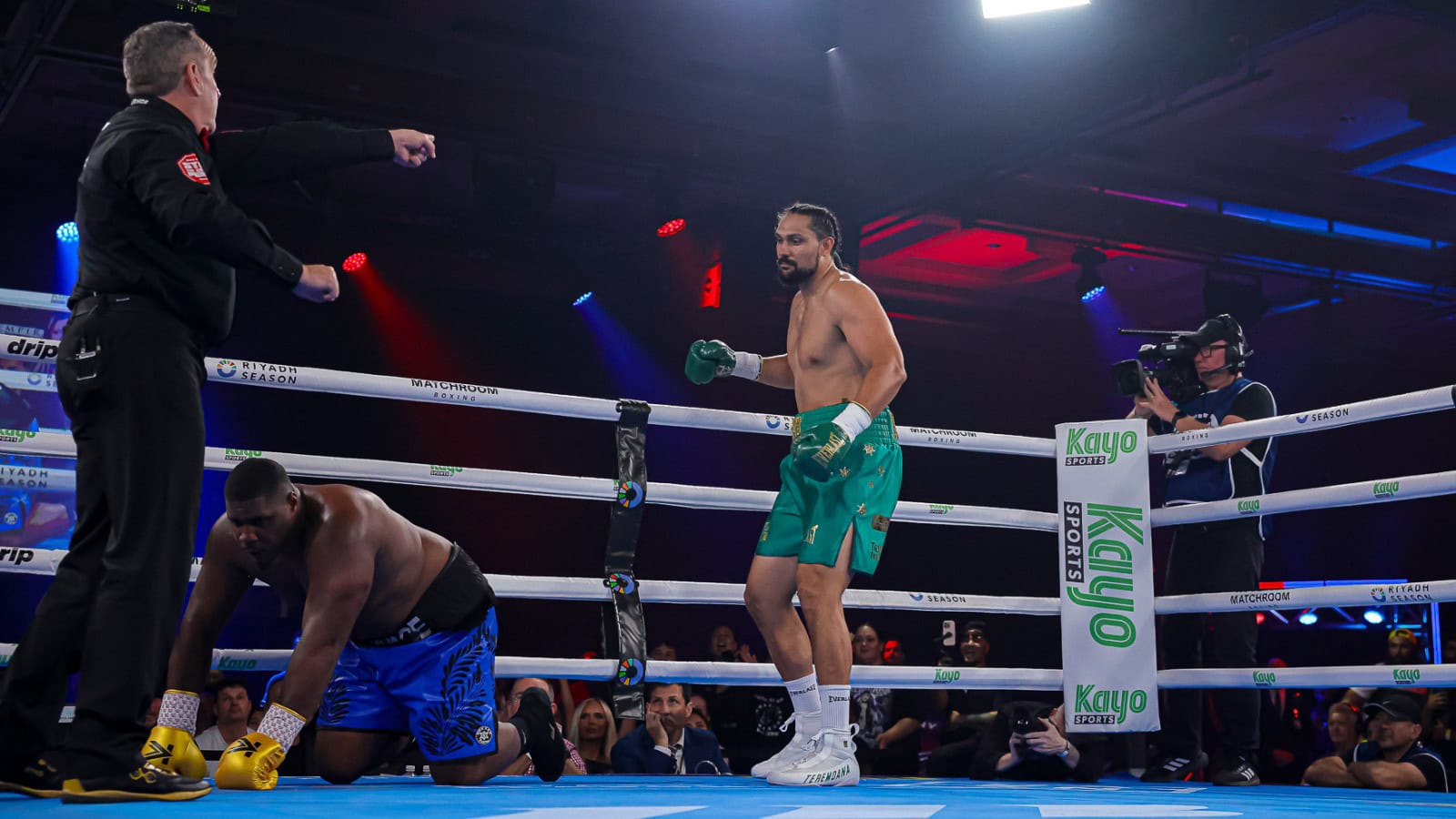 Teremoana Teremoana stands over DeAndre Savage after scoring a knockdown during their heavyweight fight at The Star Gold Coast