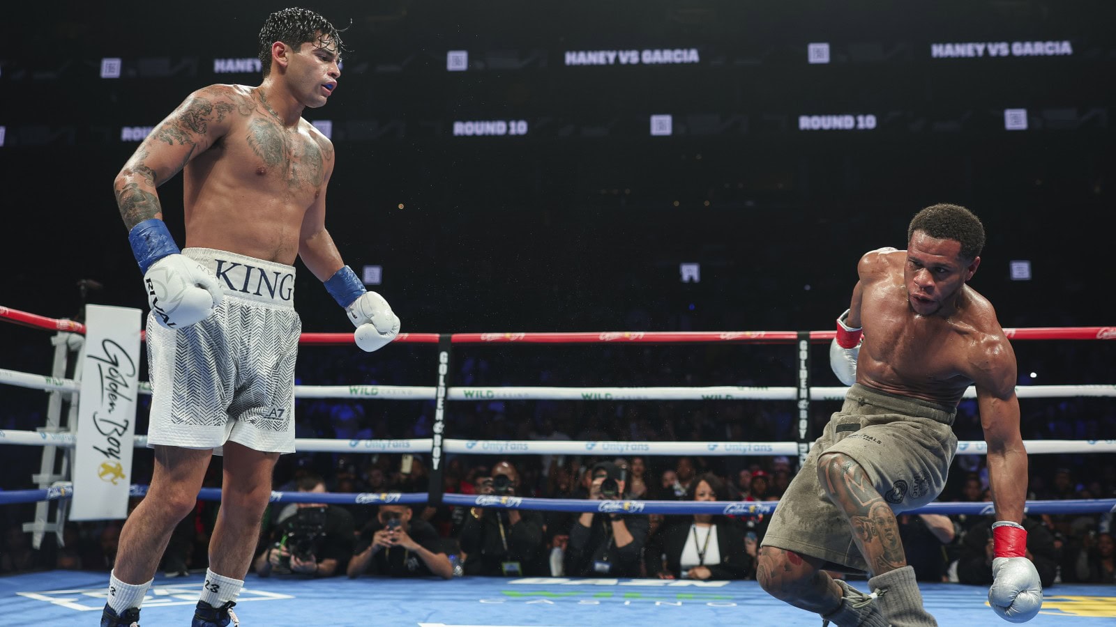 Ryan Garcia stands over Devin Haney after knocking him down during their 2024 fight