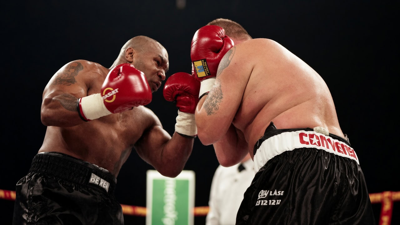 Mike Tyson attacks Brian Nielsen during their heavyweight fight in Copenhagen