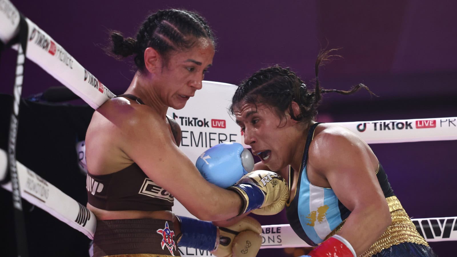 Amanda Serrano attacks Lucrecia Manzur during their 12-round unified featherweight title fight