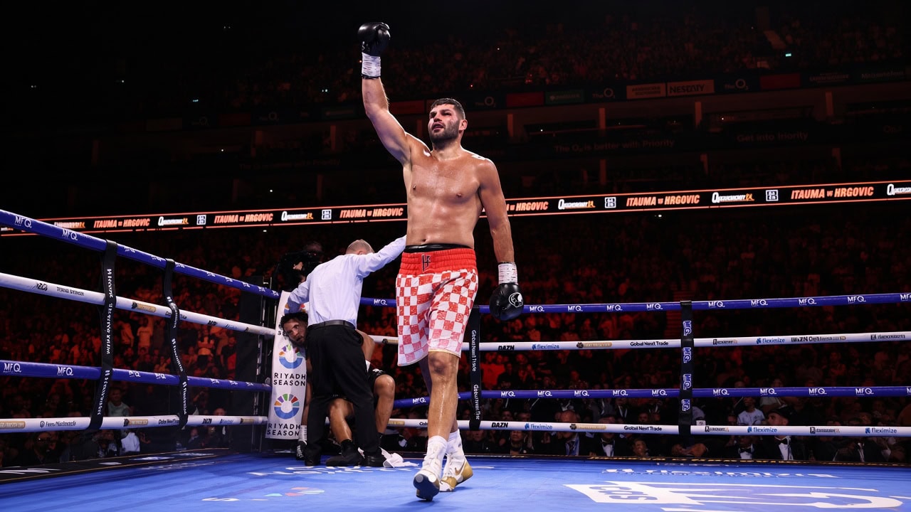 Filip Hrgovic celebrates victory as Moses Itauma remains in his corner