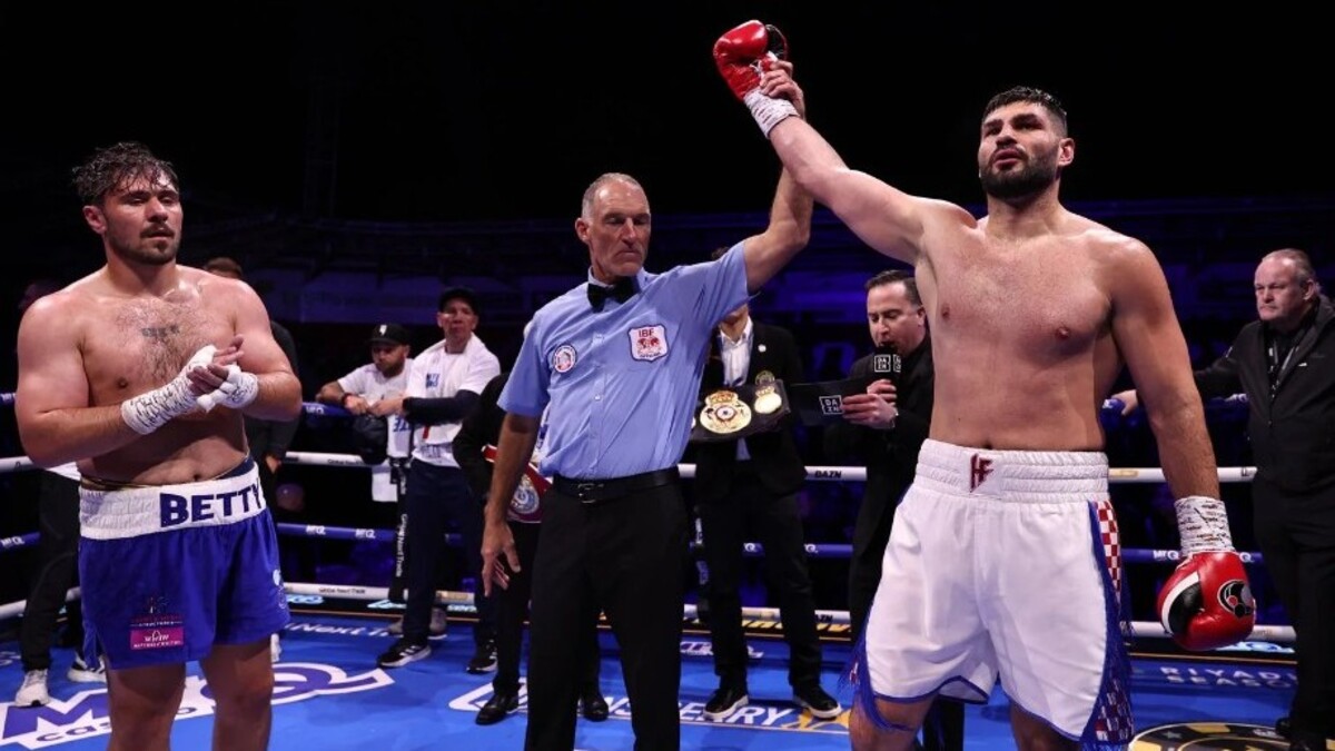 Filip Hrgovic has his hand raised after defeating Dave Allen
