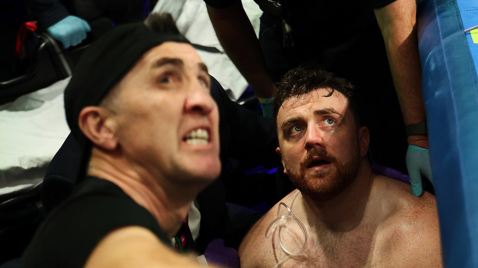 Thomas Carty receives medical attention after falling out of the ring against Dave Allen at Croke Park