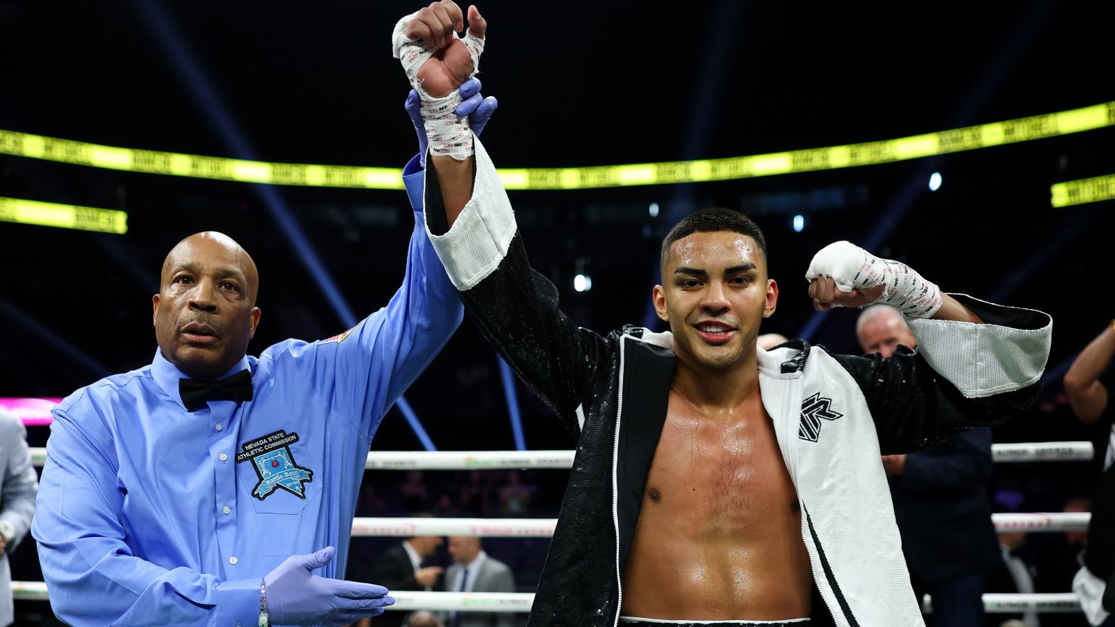 Marco Romero has his hand raised after improving to 15-0 at T-Mobile Arena in Las Vegas