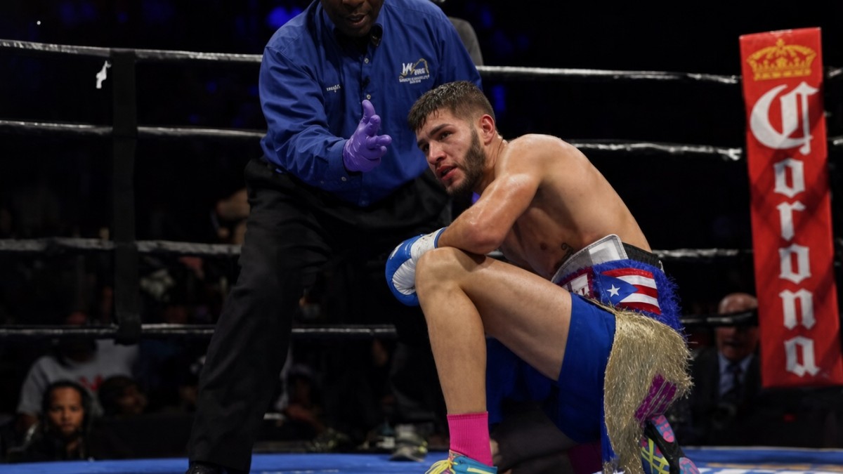 Prichard Colón sits in the ring during his professional boxing career