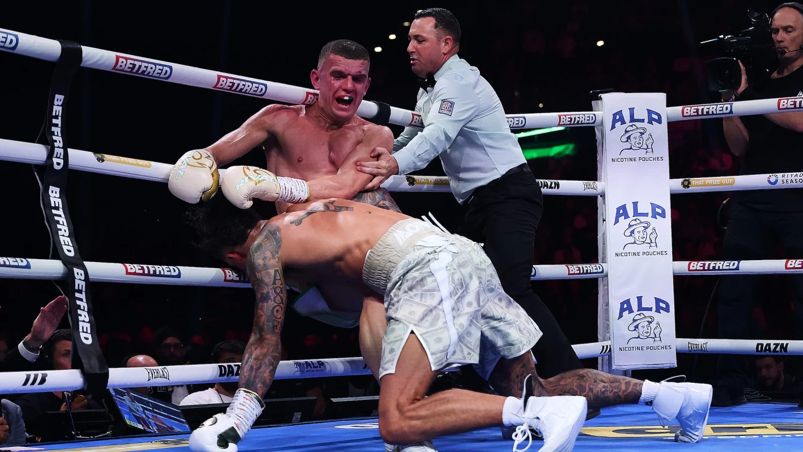 Ben Whittaker down as referee Kieran McCann intervenes against Conor Wallace
