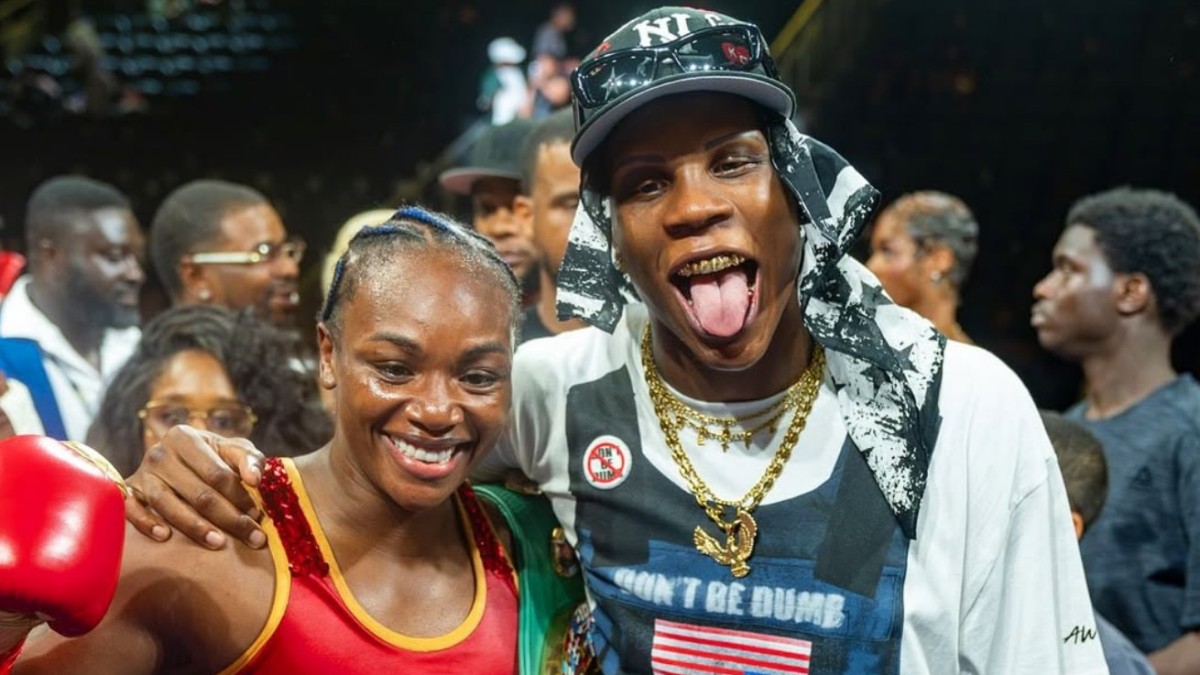 Atif Oberlton celebrates alongside Claressa Shields at a boxing event as the undefeated light heavyweight prepares for his November 7 fight against Deon Nicholson