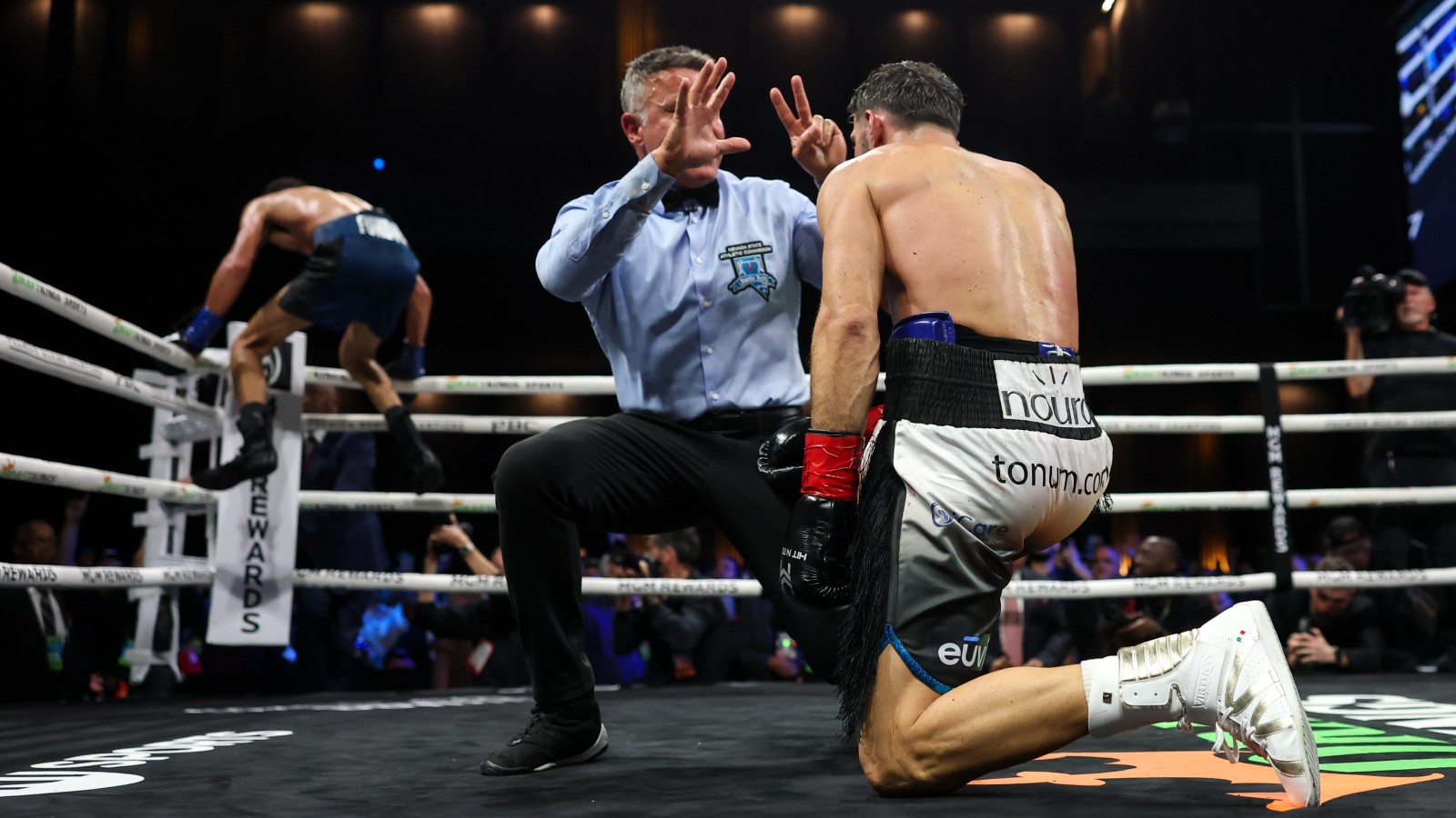Sebastian Fundora and Ermal Hadribeaj as referee Thomas Taylor intervenes during their WBC super welterweight title fight