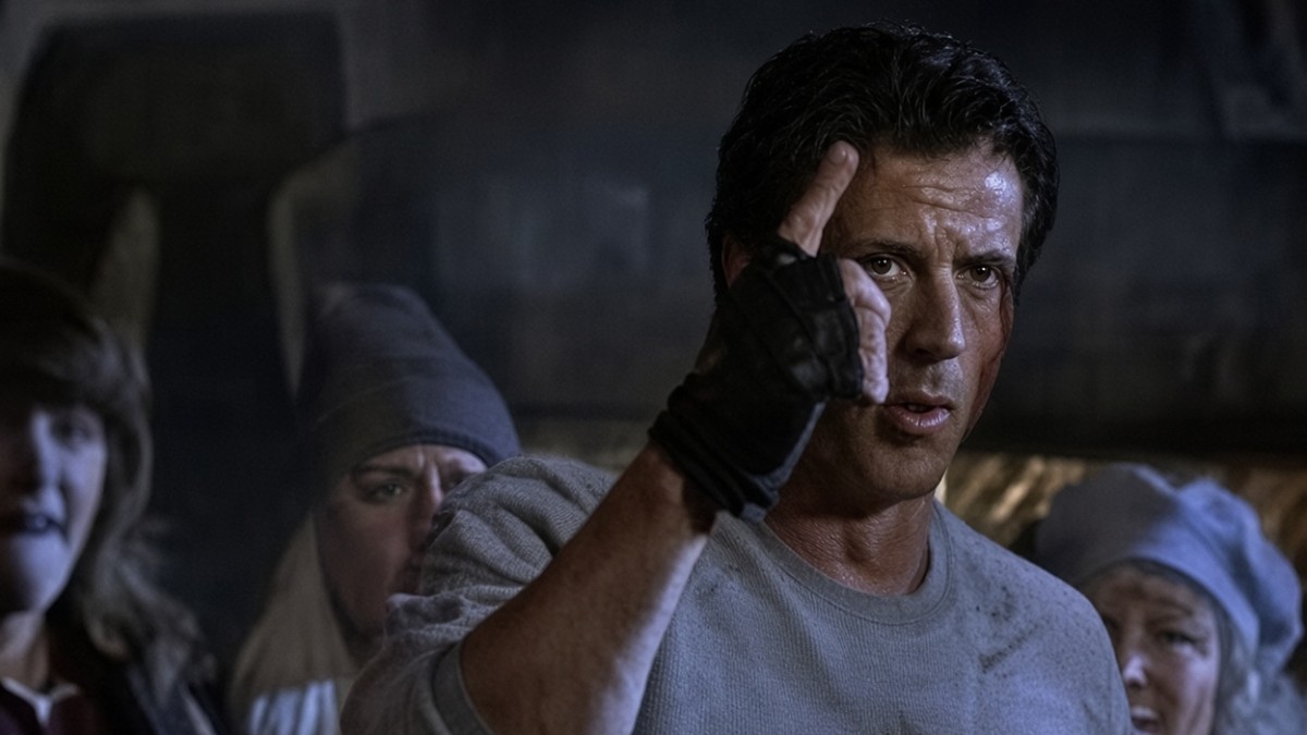 Sylvester Stallone as Rocky Balboa raises his gloved hand in a scene from Rocky Balboa, the 2006 boxing film